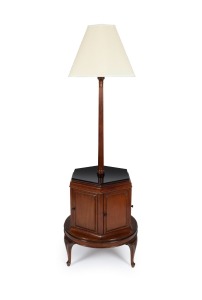 A vintage revolving bookstand and reading lamp on hexagonal cabinet base with six book compartments, cabriole legs and black glass top, 20th century, 105cm high.