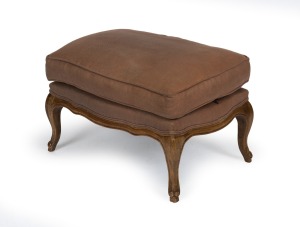 A French style footstool with carved elm cabriole legs and brown woven cotton upholstery, manufactured for Provincial Living, Melbourne, 21st century, ​​​​​​​44cm high, 75cm wide, 53cm deep.