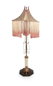 BENSON (attributed) English Art Nouveau copper and brass standard lamp on timber base with original tasselled silk and cotton shade, circa 1910, 185cm high overall.