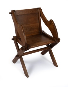 An unusual Arts & Crafts Glastonbury style timber chair, early 20th century, 85cm high, 52cm across the arms.