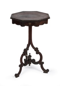 An antique English rosewood sewing table with hexagonal top and ornate tri-form base, interior fitted with compartments housing an assortment of sewing accessories, 19th century, 73cm high, 44cm wide, 44cm deep.