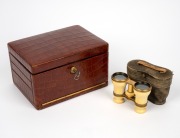 A fine quality antique English crocodile skin jewellery box, handsomely fitted in green velvet with fall front and concertina compartments, manufactured by Edwards & Sons of Regent Street, London; together with antique ivory opera glasses in original leat