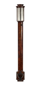 A Regency flat to the wall bow front stick barometer by WORTHINGTON of London, circa 1835. The case veneered with the finest cuts of flame mahogany, with ebony string detail and ebonized boxwood cistern cover with applied ebony mouldings. Ogee moulded cad