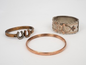 A fine quality antique sterling silver bangle decorated with two-tone gold highlight, together with two antique gold plated bangles, 19th century, (3 items).