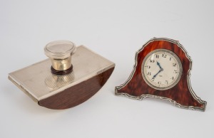 An antique sterling silver and tortoise shell clock, together with a sterling silver ink blotter, early 20th century, (2 items), the clock 9cm high, 13cm wide.