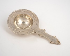A Japanese export silver tea strainer with bamboo decoration, early 20th century, ​​​​​​​seal mark to reverse, 14.5cm long, 50 grams.