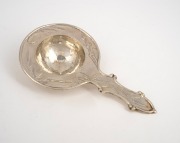 A Japanese export silver tea strainer with bamboo decoration, early 20th century, ​​​​​​​seal mark to reverse, 14.5cm long, 50 grams.