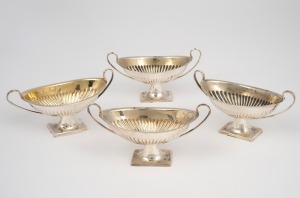 A set of four antique English sterling silver salt cellars, by Atkin Brothers of Sheffield, circa 1904, 4.5cm high, 10cm wide, 137 grams total.