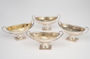 A set of four antique English sterling silver salt cellars, by Atkin Brothers of Sheffield, circa 1904, 4.5cm high, 10cm wide, 137 grams total.