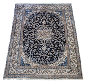 A large and impressive Persian hand-knotted wool rug on blue and cream ground, 490 x 305cm.