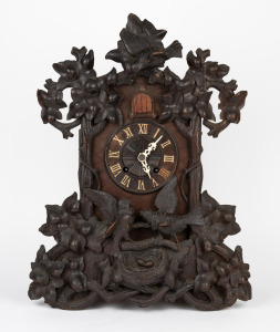 JAKOB B&Auml;UERLE & SON antique Black Forest spring table cuckoo clock, circa 1880. Stained lindenwood case decorated with scrolling vines, leaves and cuckoos amongst a nest containing two eggs. Dial with applied Roman numerals. Two train fusee movement with 
