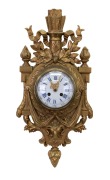 An antique French Cartel clock in gilt metal case with ram's head decoration, eight day time and strike movement with Roman numerals under convex glass, 19th century, note: later painted gold finish. ​​​​​​​53cm high.