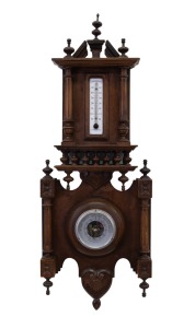 An antique wall barometer and thermometer mounted in a carved and turned walnut case, 19th/20th century, ​​​​​​​72cm high.