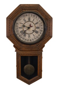 GILBERT antique American wall clock in oak case with eight day and strike movement and calendar dial, early 20th century, ​​​​​​​83cm high.