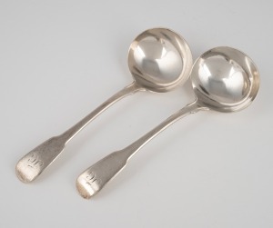 A pair of Georgian sterling silver sauce ladles with engraved monograms, by William Eley & William Fearn of London, circa 1806, 17cm long, 120 grams total.