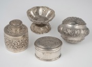 Antique Asian silver tea caddy, oval lidded box, engraved cup and unusual amulet box with floral decoration, 19th/20th century, (4 items), ​​​​​​​the tea caddy 6cm high, 270 grams total.