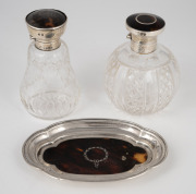 Antique sterling silver and tortoiseshell dish and two scent bottles, early 20th century, (3 items), the dish 13cm wide.
