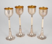 W.M.F. set of four German silver plated schnapps goblets with turned ivory stems, circa 1900, 13.5cm high.