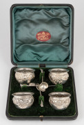 An antique English boxed set of four sterling silver salt cellars with sterling silver spoons, by Colen Cheshire of Birmingham, circa 1891, ​​​​​​​the box 17cm wide, 184 grams total.
