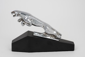 JAGUAR vintage chrome finished car mascot mounted on later ebonized timber base, 20th century, ​​​​​​​9cm high, 13cm long overall.