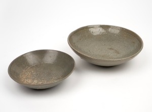Two antique Korean celadon glazed bowls, Koryo Dynasty, 12th/13th century, the smaller example decorated with incised lotus pattern, 19cm and 14.5cm diameter.