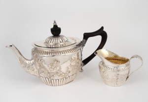 An antique English sterling silver teapot with ebonized timber handle and finial; together with a matching milk jug, made by John Newton Mappin of London, circa 1897, (2 items), 13cm high, 24cm wide, 517 grams total (including handle and finial).