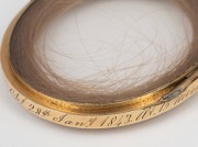 A 9ct gold chain (4.2 grams) with an antique gold plated memorial hair locket; together with a sterling silver and pearl brooch, (2 items). - 4