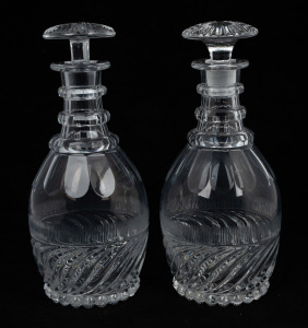 A pair of antique English crystal decanters with target stoppers, 19th century, ​​​​​​​27cm high.