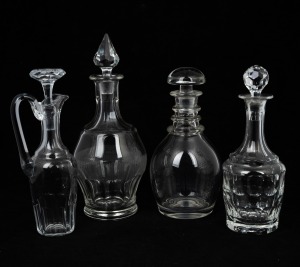 Three crystal decanters and a crystal wine jug, 19th/20th century, (4 items), ​​​​​​​the largest 30cm high.