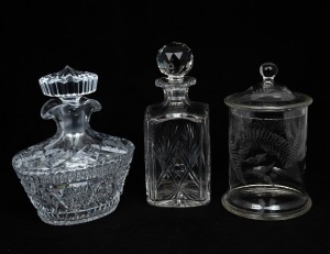 An antique fern etched Australian glass lidded jar; together with two heavy cut crystal decanters, 19th and 20th century, (3 items), the jar 21cm high.