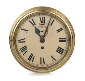An antique English bulkhead clock in brass case with Roman numerals, 19th century, 24cm diameter.