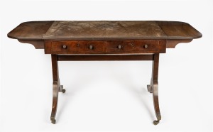 An antique English mahogany drop-side two drawer sofa table, early 19th century. Note: Faded and worn condition, missing handles to dummy drawers on reverse. 75cm high, 95cm wide (151cm extended), 62cm deep.