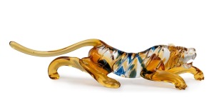 ERCOLE BAROVIER (1889-1974) Murano glass prowling tiger statue in amber with blue stripes, for VETRERIA ARTISTICA BAROVIER & TOSO, circa 1930, 26cm long.