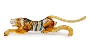ERCOLE BAROVIER (1889-1974) Murano glass prowling tiger statue in amber with blue stripes, for VETRERIA ARTISTICA BAROVIER & TOSO, circa 1930, 26cm long. - 2