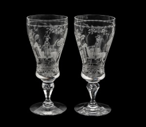 KOSTA CRYSTAL pair of Swedish crystal goblets, each handsomely engraved with wheel cut decoration by VICKE LINDSTRAND, housed in original fitted boxes, 16cm high each.