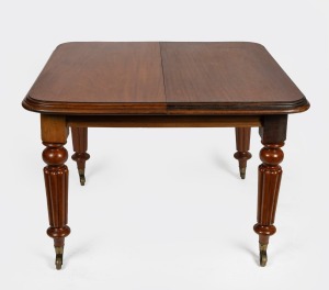 An antique mahogany campaign dining table with single leaf extension, mid 19th century. Note: Legs detachable (one faulty and in need of restoration). 74cm high, 107cm wide (147cm extended), 105cm deep.