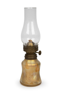 TIFFANY (attributed) American Art Nouveau iridescent glass miniature oil lamp with single brass burner and original glass chimney, circa 1900, ​​​​​​​21cm high overall.