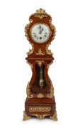 An attractive antique French miniature longcase timepiece in mahogany case with Rococo ormolu mounts, segmented enamel dial with Roman numerals, minute track and eight day spring driven movement, circa 1890. 49cm high.
