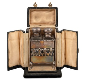 An antique sterling silver two bottle perfume set housed in original plush fitted box, 19th/20th century, the box 13cm high.