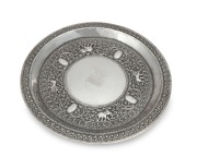 An antique Indian silver salver with repousse decoration of elephants and tigers, bearing engraved coronet with nine pearls signifying a viscount with shield below, 19th century, maker's stamp "S.S.", 25.5cm diameter, 311 grams.