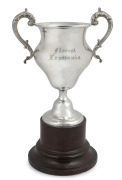 RMS LUSITANIA (CUNARD LINER) antique sterling silver presentation trophy cup, engraved "Floreat Lusitania" on original turned timber plinth. Made by Daniel George Collins of Sheffield, circa 1910. The cup 26.5cm high, 37cm high with base, 700 grams. Acco