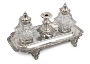 An antique English sterling silver inkstand desk set with silver mounted crystal bottles, 19th century, ​​​​​​​25cm wide, the base 506 grams (not including bottles or silver lids).