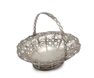 A Georgian sterling silver pierced basket with swing handle, made in London, circa 1768, 13cm high, 16.5cm wide, 140 grams.