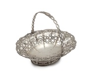 A Georgian sterling silver pierced basket with swing handle, made in London, circa 1768, 13cm high, 16.5cm wide, 140 grams.