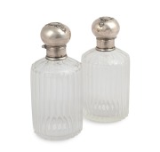 A pair of antique sterling silver mounted crystal scent bottles, late 19th century, ​​​​​​​14.5cm high.