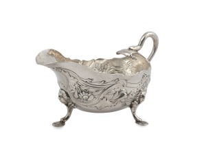 A Georgian silver Rococo sauce boat with snake handle, most likely Channel Islands, mid 18th century, stamped "H.W.", and engraved with ownership monogram "W.E.M.", 9cm high, 15cm wide, 200 grams.
