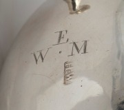A Georgian silver Rococo sauce boat with snake handle, most likely Channel Islands, mid 18th century, stamped "H.W.", and engraved with ownership monogram "W.E.M.", ​​​​​​​9cm high, 15cm wide, 200 grams. - 2