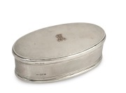 An antique English sterling silver oval jewellery casket with engine turned decoration and applied rose gold monogram, made in London, circa 1912, ​​​​​​​6cm high, 17.5cm wide, 308 grams (including velvet lining and leather base).