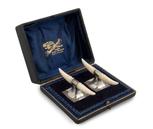 A pair of English Art Nouveau sterling silver and ivory knife rests housed in original plush fitted box, made in Chester, circa 1898, ​​​​​​​each rest 4cm high, 9cm wide.