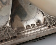 A pair of English Art Nouveau sterling silver and ivory knife rests housed in original plush fitted box, made in Chester, circa 1898, ​​​​​​​each rest 4cm high, 9cm wide. - 2